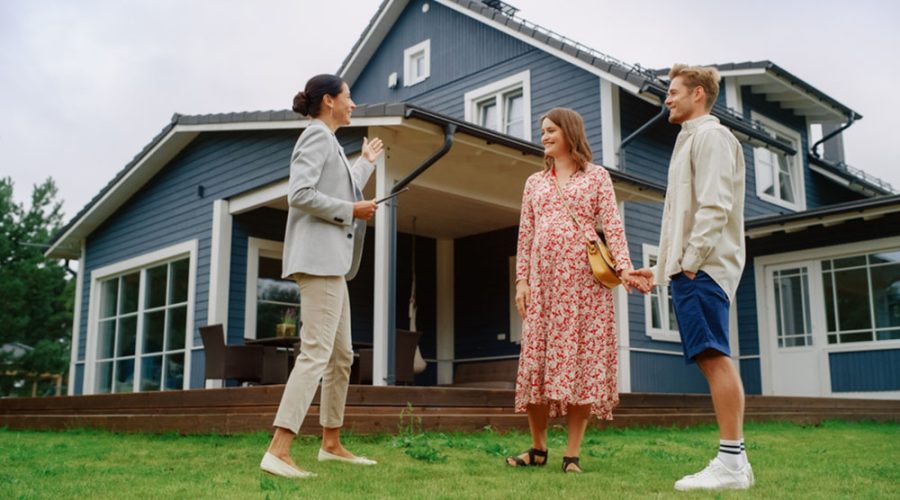 A Realtor shows a home to a couple. Austin, TX has recently seen a turn of events where the city is a buyer's market.