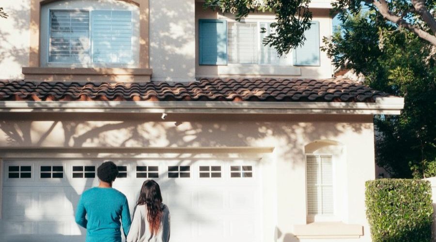 a couple thinks about buying a house